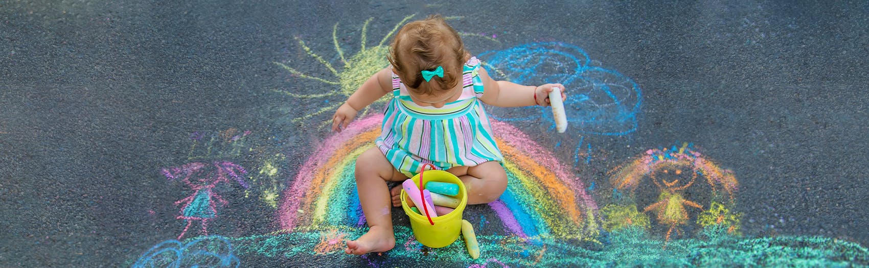 A child drawing with chalk